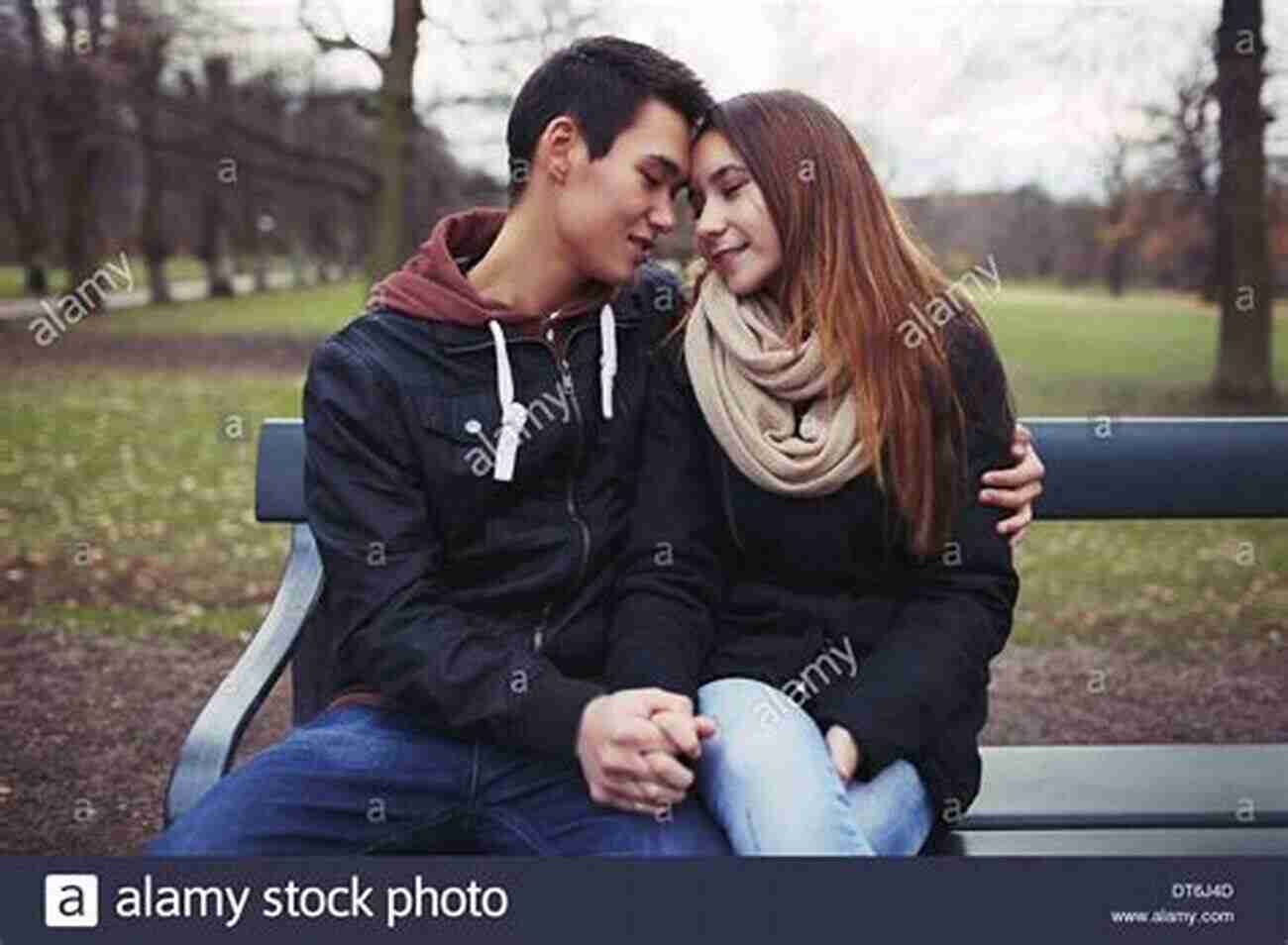 A Couple Holding Hands And Sharing A Moment Of Vulnerability While Sitting On A Park Bench The Friendship Factor: How To Get Closer To The People You Care For