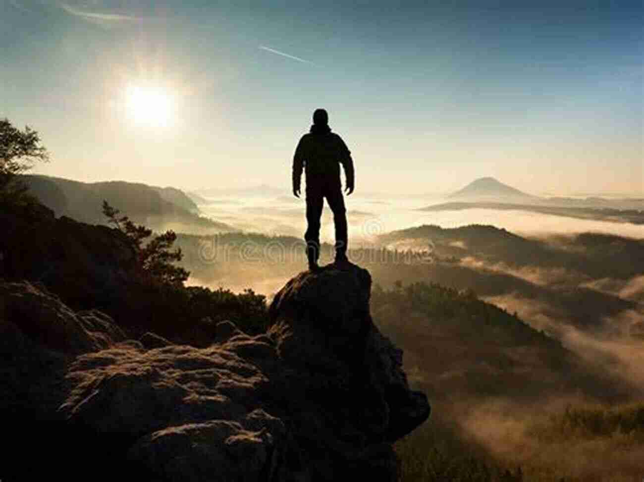 A Hiker Standing On A Rocky Peak With A Breathtaking View Of Mountains And Valleys That Wild Country: An Epic Journey Through The Past Present And Future Of America S Public Lands