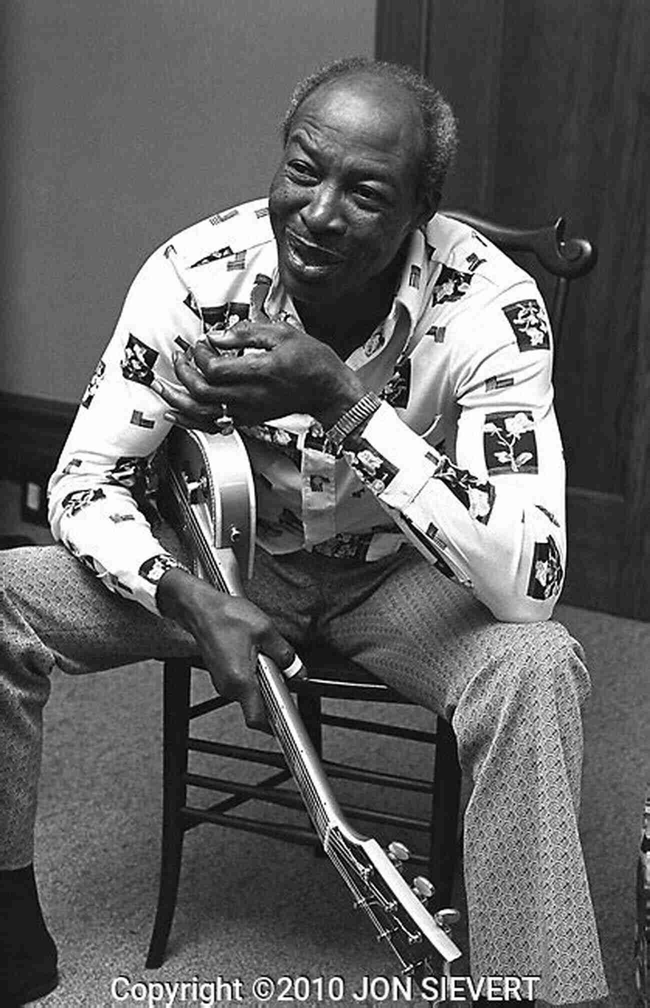 Jimmy Reed Playing His Guitar, Captivating Audiences With His Soulful Blues Big Boss Man: The Life And Music Of Bluesman Jimmy Reed