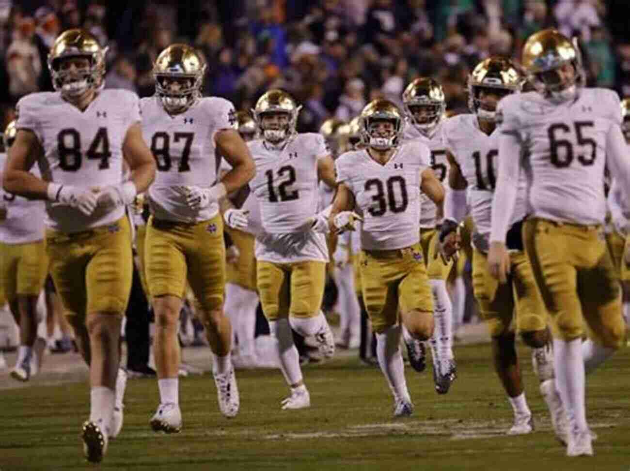 Notre Dame Football Players On A Field Talking Irish: The Oral History Of Notre Dame Football