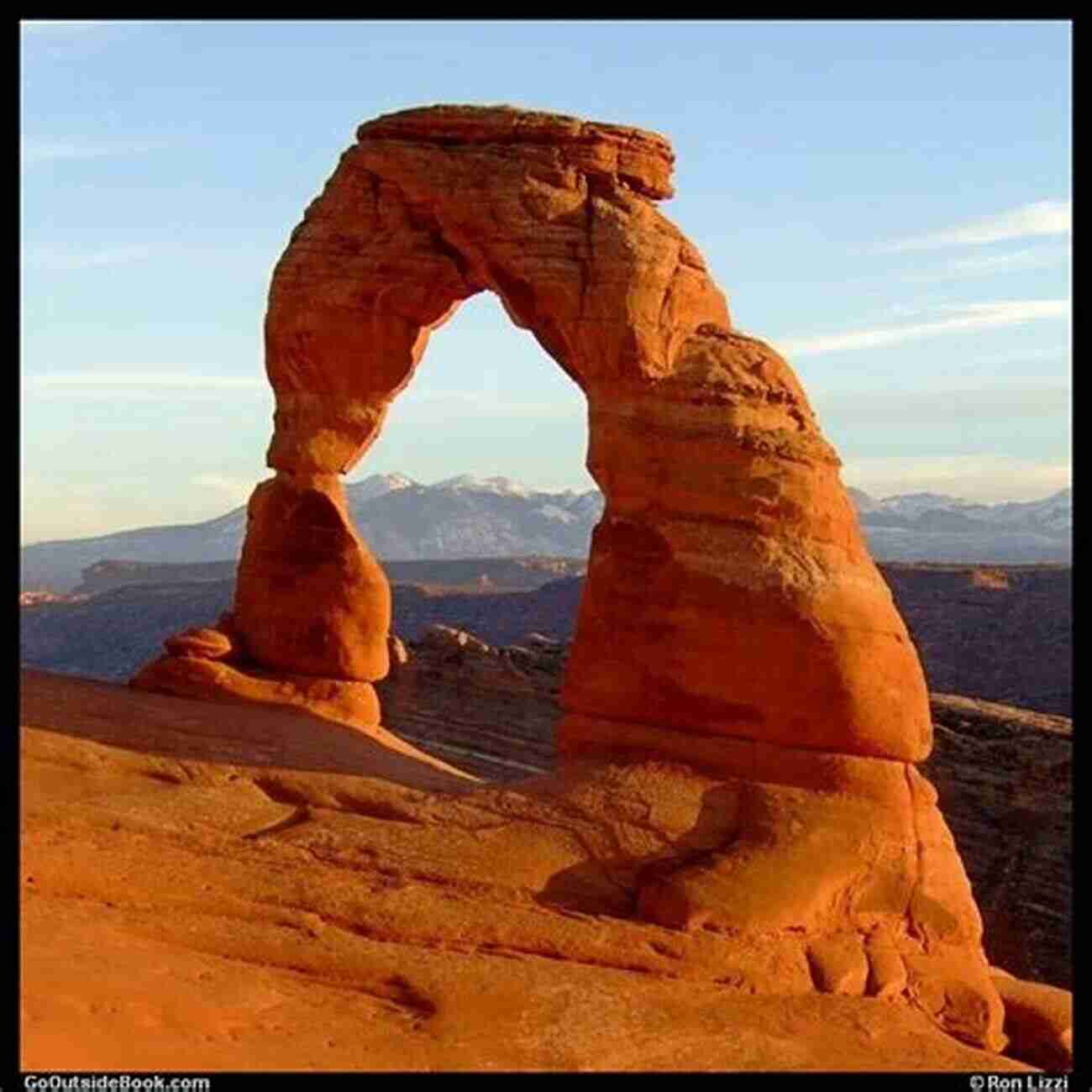 Photograph Of Delicate Arch At Sunset, With Vibrant Hues Painting The Sky And Illuminating The Majestic Stone Arch. Arches National Park: Photographs Of Arches National Park