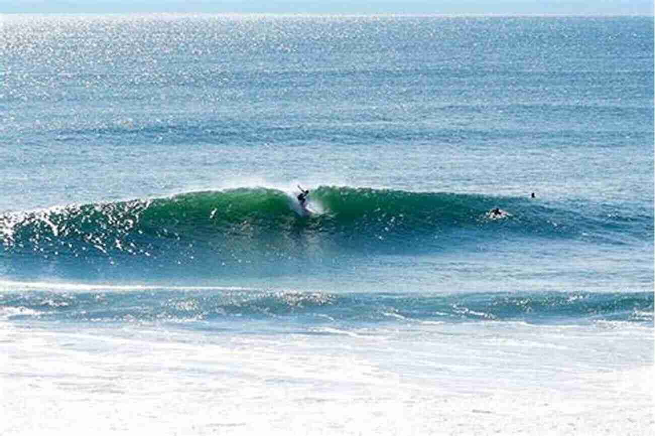 Sunrise Surf Spot In Japan A Breathtaking View Of Surfers Catching Waves During Sunrise Sunrise: Surf Spot In Japan