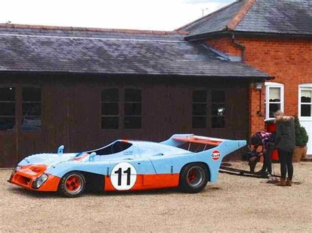 The Iconic Gulf Mirage Car Racing Through The Tracks, Leaving A Trail Of Dust Behind It. Gulf Mirage 1967 To 1982 (WSC Giants) Ed McDonough